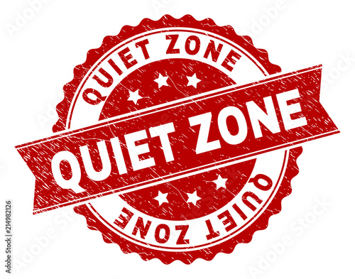 QUIET ZONE seal watermark with corroded texture. Rubber seal imitation has round medallion form and contains ribbon. Red vector rubber print of QUIET ZONE caption with corroded texture.