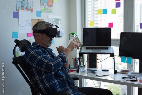 Man using virtual reality headset at home photo