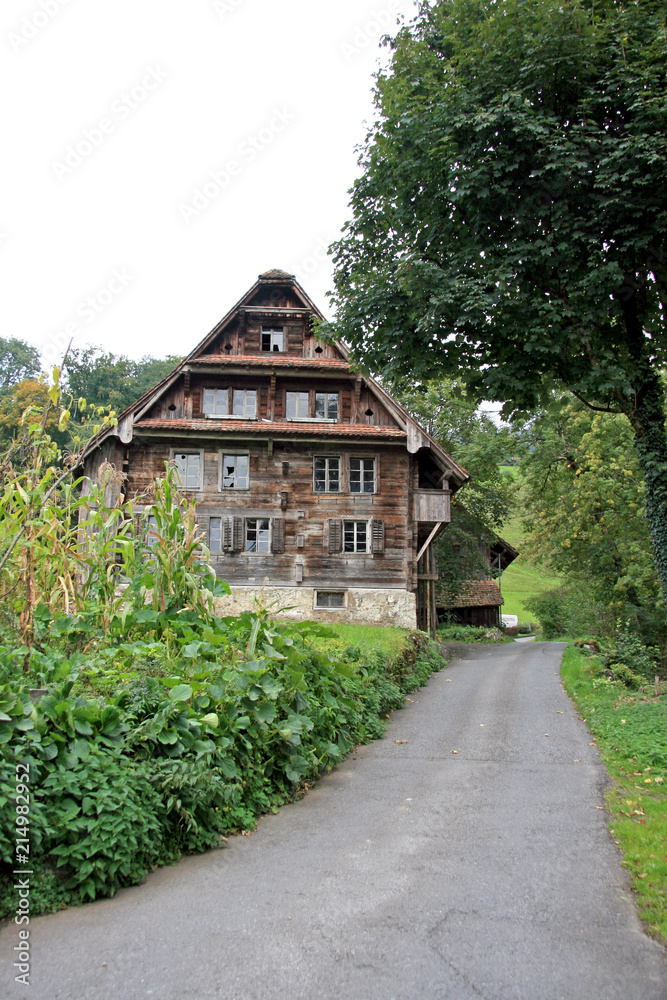 Abandoned house / Old collapsing house in the Alpine village Abandoned house / Old collapsing house in the Alpine village