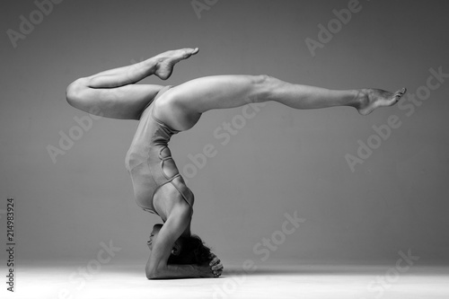 Canvastavla Young beautiful yoga woman is posing in studio. Black and white