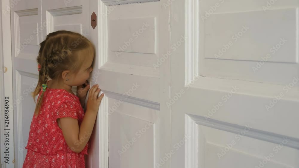 Little spy peeking through the door Little spy peeking through the door