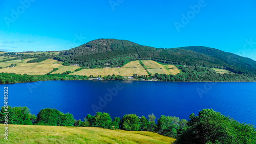 The blue water of Loch Ness - the most famous lake in Scotland - aerial view