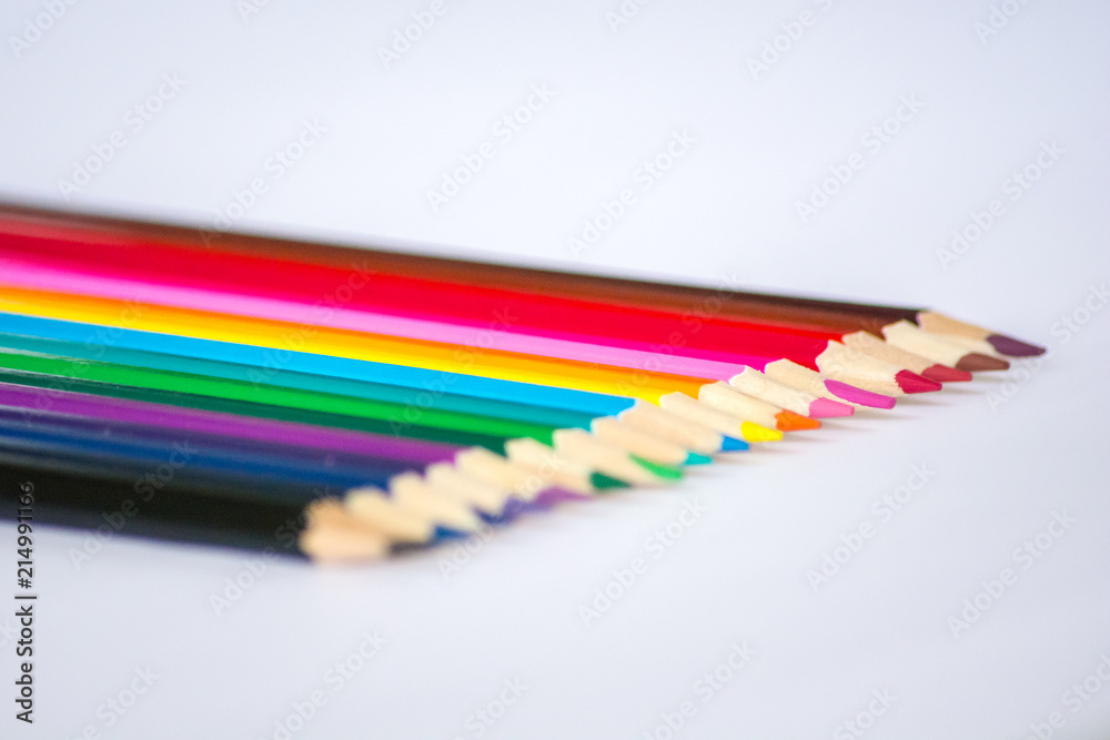Naklejka premium Colorful wooden pencils isolated on white background