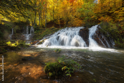 Dokuzak waterfall in Strandja mountain  Bulgaria during autumn. Beautiful view of a river with an waterfall in the forest. Magnificent autumn landscape.