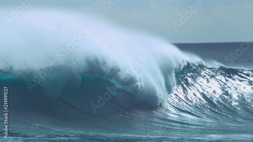 CLOSE UP: Cool shot of emerald ocean wave rolling towards sunny beaches in Chile