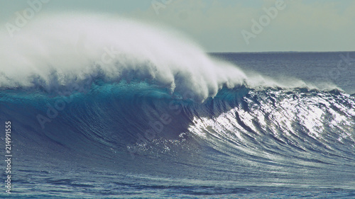 CLOSE UP: Awesome shot of huge tube wave crashing near remote exotic island.