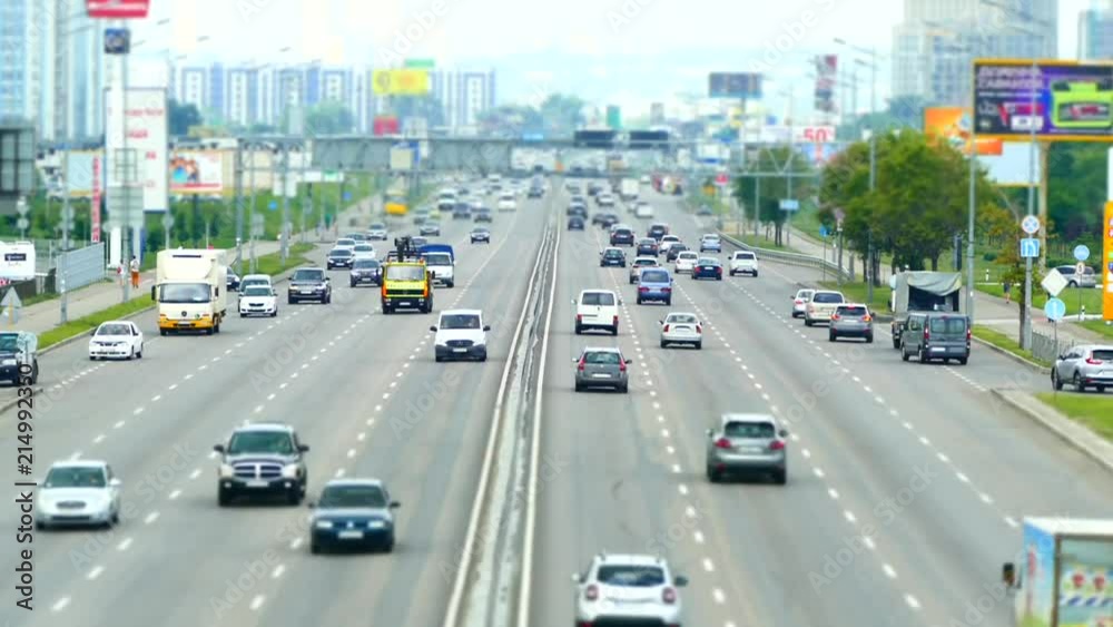 Traffic on the streets of a big city. Many cars quickly go on the highway. Ukraine, Kiev, July 2018.