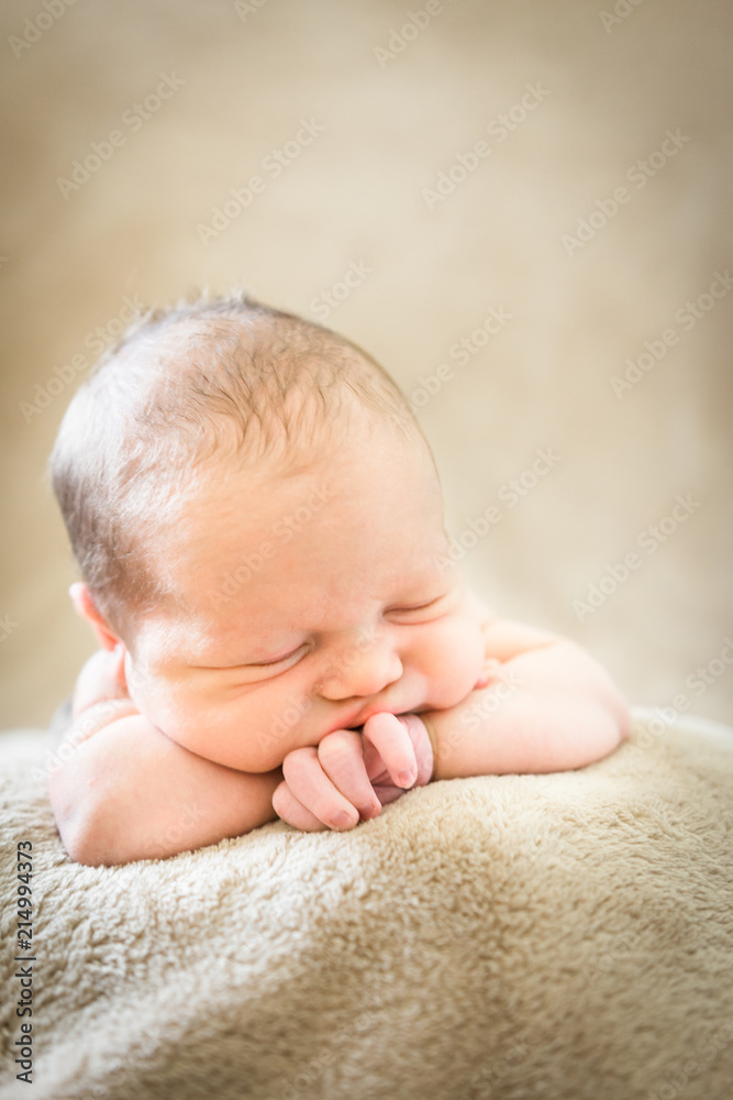 Newborn baby boy chin propped up on hands Stock Photo Adobe Stock