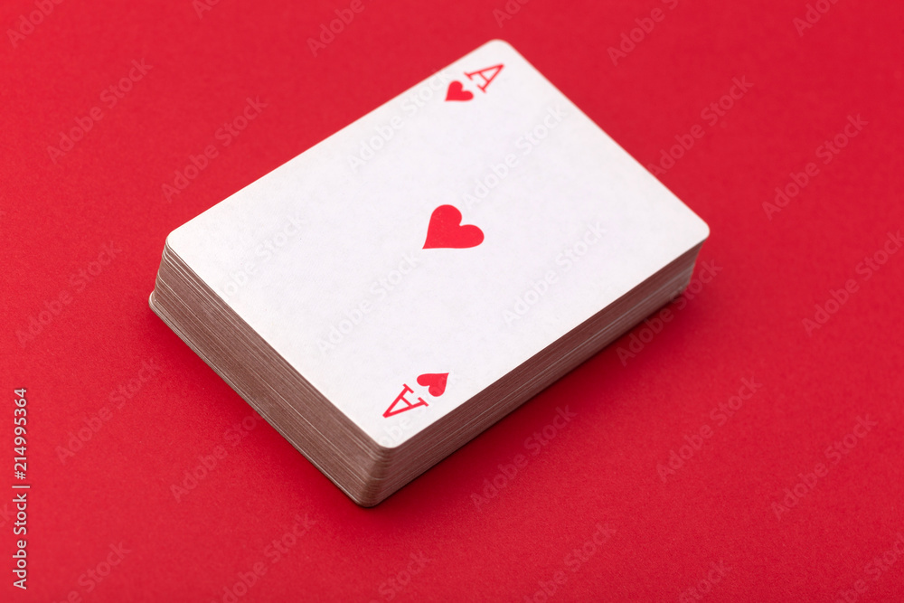 deck of playing cards with an ACE of hearts on top deck of playing cards with an ACE of hearts on top