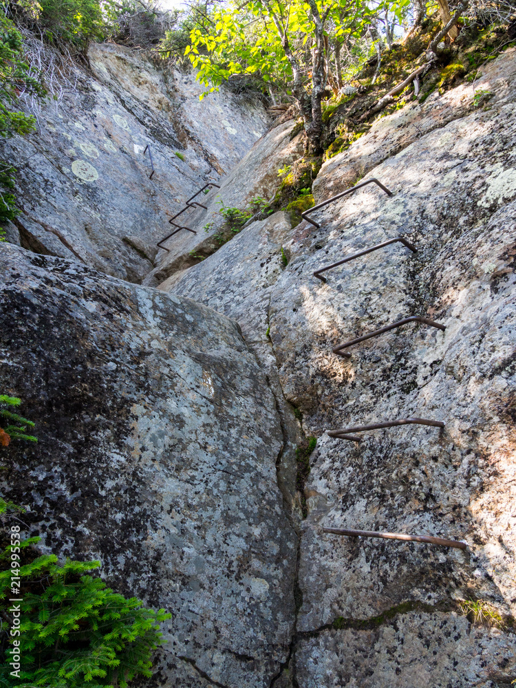 Metal Holds in Rock, Hiking Trail, Ladder up Rock Metal Holds in Rock, Hiking Trail, Ladder up Rock