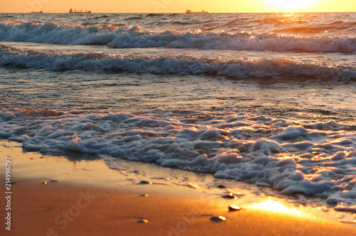 Wallpaper Mural Sunset over the sea. Reflection of sunlight in the sea waves. Red sky in the rays of the sunset. Torontodigital.ca