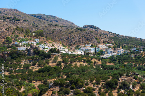 Village on Lasithi Makrigialos mountains. Wonderland tour  steep slopes  rocky peaks for hiking adventure recreation sports in Crete  Greece.