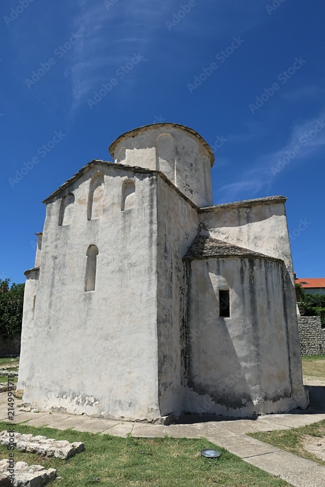 Eastern wall of Church Of Holy Cross in Nin town, Croatia, Adriatic. Known as smaller cathedral, this church is most notable religious landmark in Nin