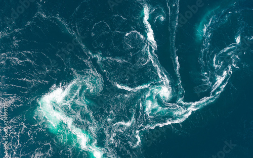 Abstract water currents, rapids and whirlpools in fjord. Saltstraumen, Norway © raland
