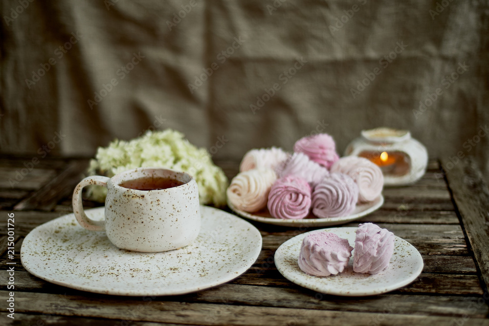 Delicate pastel colors. Tea party in the open air. Ceramics in a rustic style, handmade. Delicate marshmallow pink shades. Delicate pastel colors. Tea party in the open air. Ceramics in a rustic style, handmade. Delicate marshmallow pink shades.