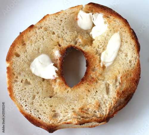 Toasted half bagel with butter.