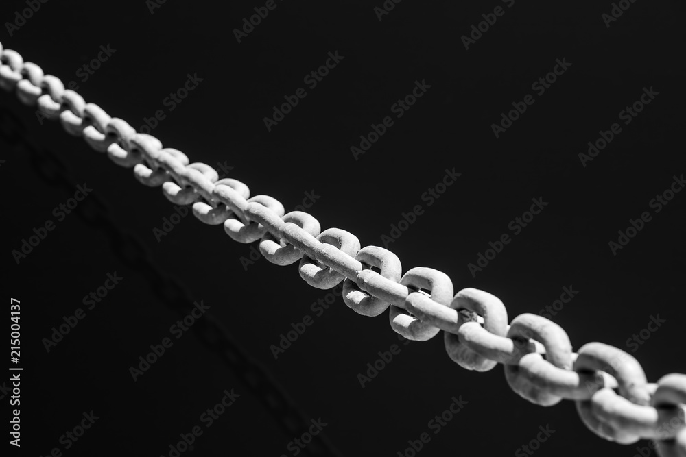 Chains close up with sea in a port background