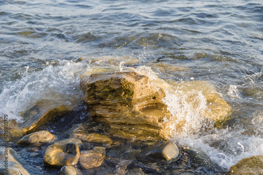 Sea waves are fighting against the big rocks on the shore. Sea waves are fighting against the big rocks on the shore.