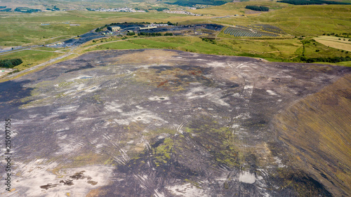 Aerial drone view of a large, buried landfill dump site in Wales