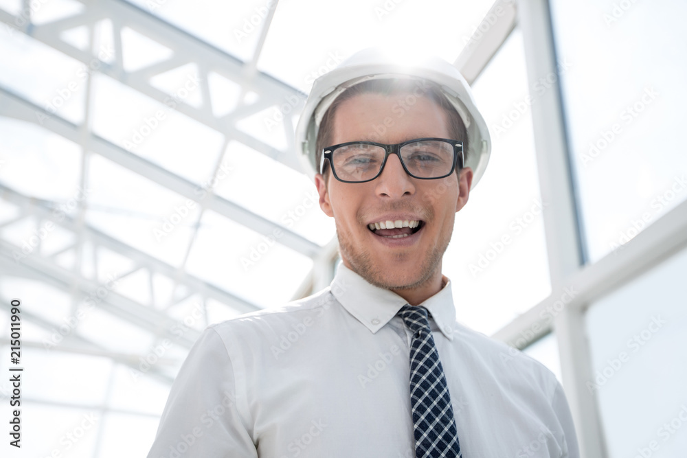 young architect on the background of a bright office young architect on the background of a bright office