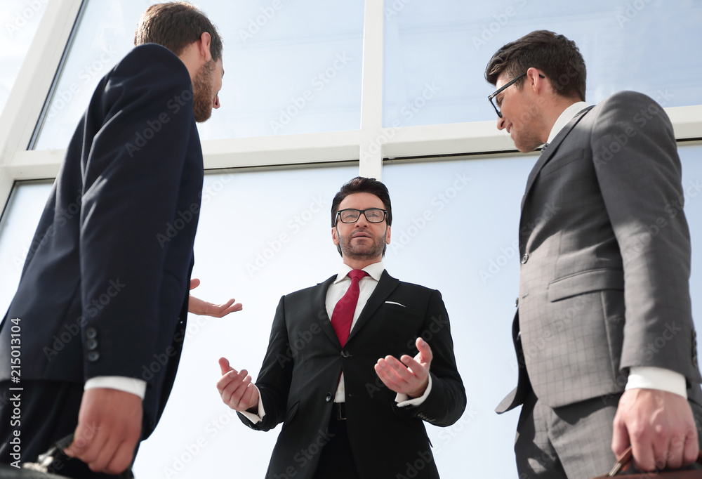 bottom view.a group of business people discussing business problems. bottom view.a group of business people discussing business problems.