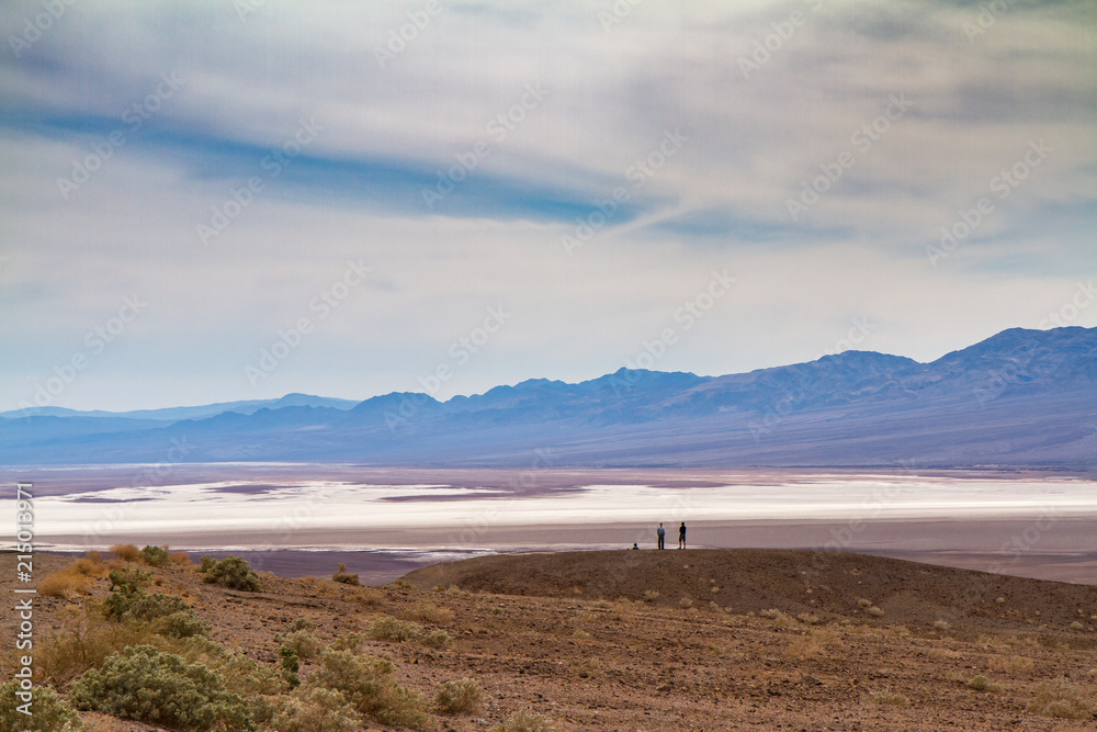 Two People Overlooking Badwater Basin From a Hill, Death Valley Two People Overlooking Badwater Basin From a Hill, Death Valley
