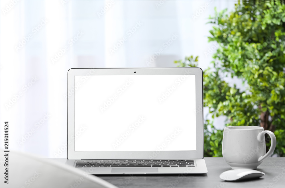 Laptop on desk in home office. Comfortable workplace Laptop on desk in home office. Comfortable workplace