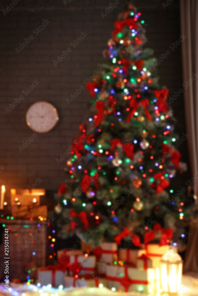 Blurred view of stylish room interior with decorated Christmas tree