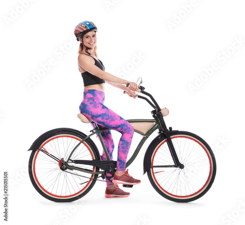 Portrait of sporty woman with bicycle on white background