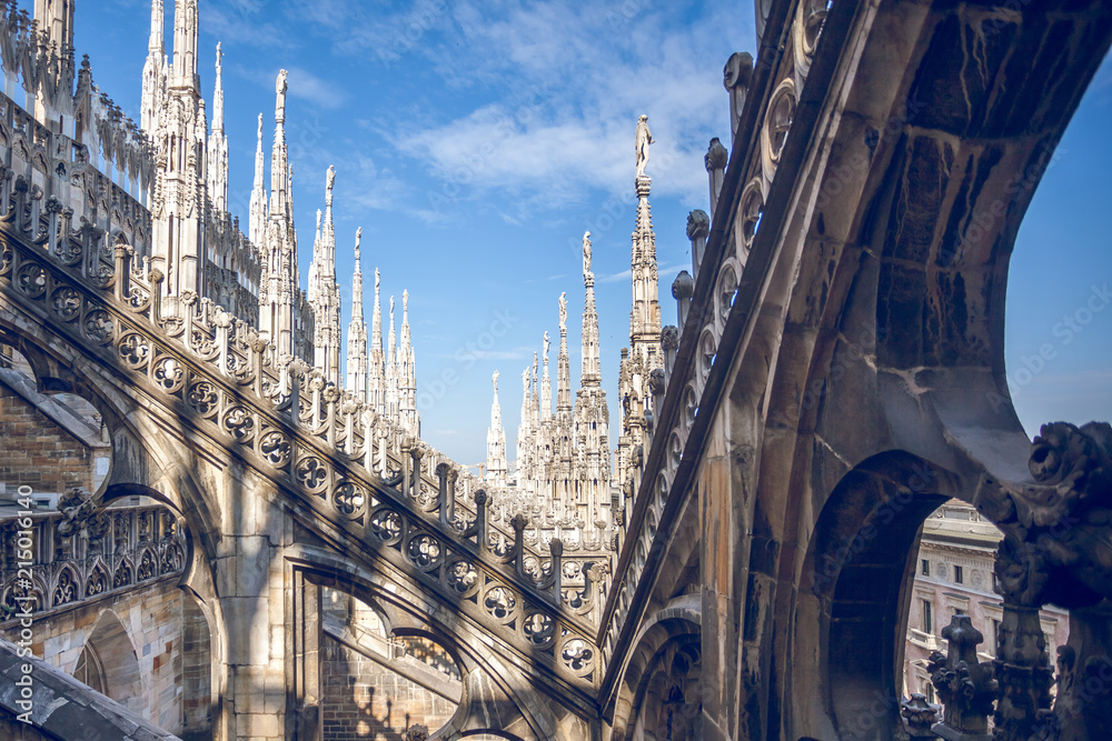 view of Gothic architecture and art on the roof of Milan Cathedral (Duomo di Milano), Italy