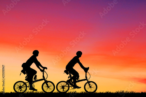 silhouette Sport man whit bike on sunrise