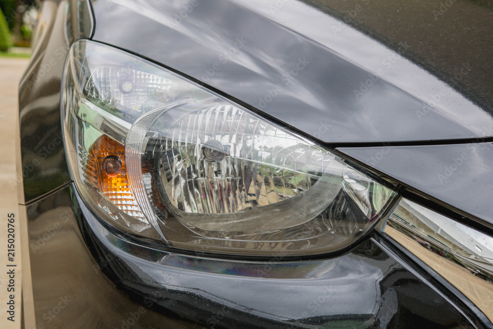 Black car front headlight with shallow depth of field Black car front headlight with shallow depth of field