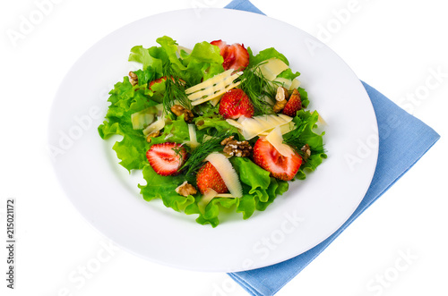 Salad with strawberries, cheese, green leaves, walnut