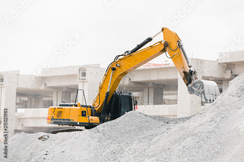 Excavator working at the construction site rock moving for building tollway