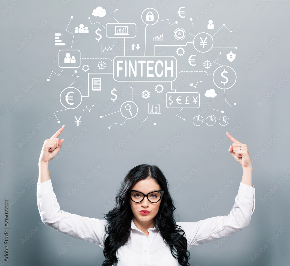 Fintech theme with business woman pointing upwards on a gray background Fintech theme with business woman pointing upwards on a gray background