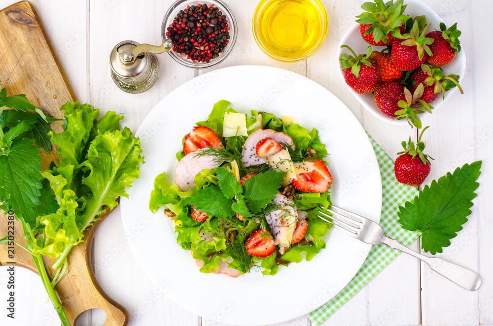 Vegetable salad with ham, strawberries, chia seeds