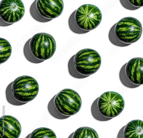 Whole watermelons arranged on a white background
