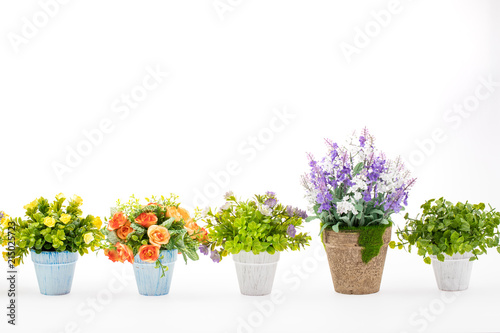Obraz na płótnie Rows of colorful fake flowers on white background, made from cloth and plastic for decoration w salonie