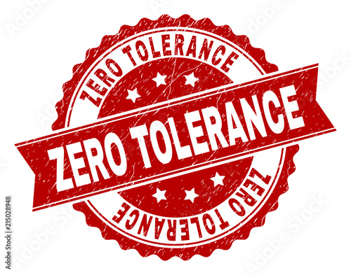 ZERO TOLERANCE seal print with corroded surface. Rubber seal imitation has round medal shape and contains ribbon. Red vector rubber print of ZERO TOLERANCE title with corroded texture.