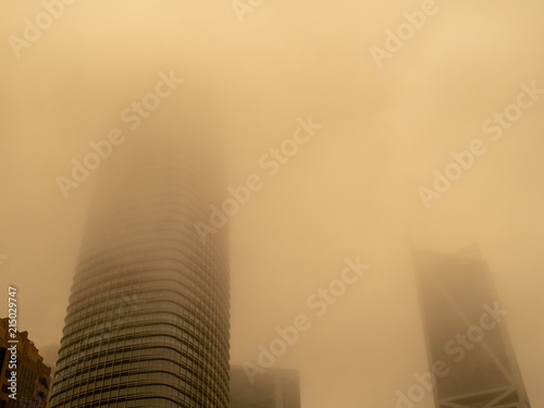 Some skyscrapers concealed by smog of nearby wildfires, making low air quality 