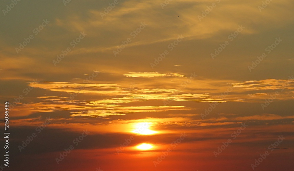 Beautiful golden fiery sunset background over the city 