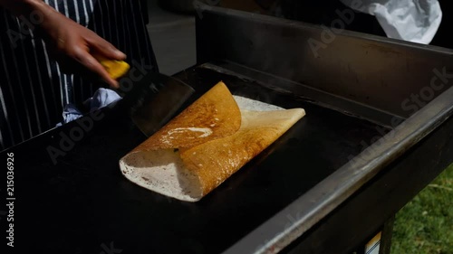 Chef from Rishis Glasgow wrapping the potato filling with dosa photo