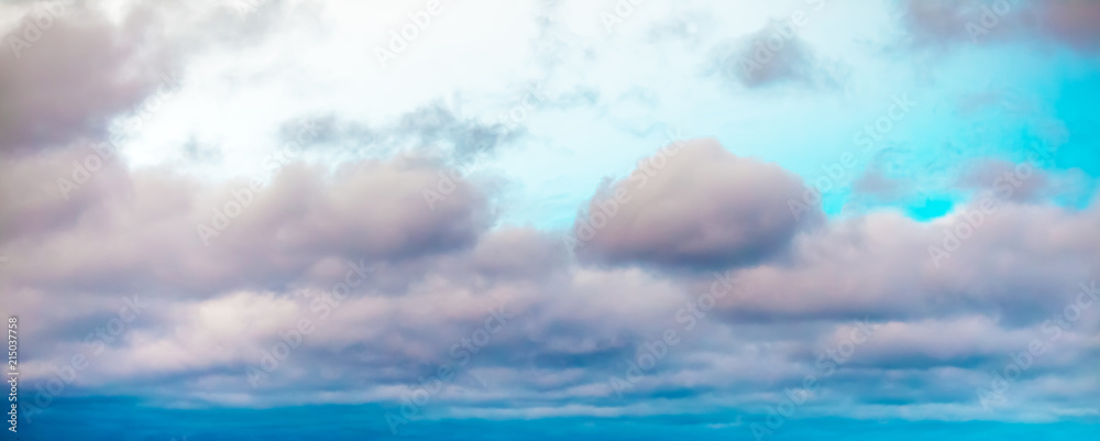 Colorful cloudy bright blue sky texture background
