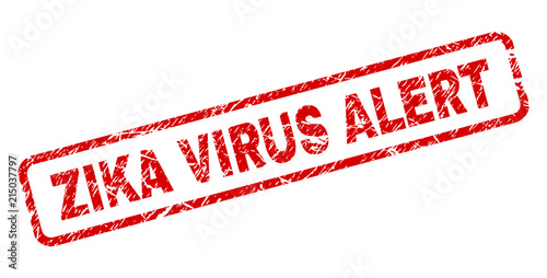 ZIKA VIRUS ALERT stamp seal print with grunge style. Red vector rubber print of ZIKA VIRUS ALERT caption with retro texture. Text caption is placed inside rounded rectangle frame.