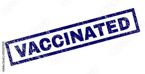 Rectangle VACCINATED seal watermark with corroded texture. Rubber seal imitation has rectangle frame. Blue vector rubber print of VACCINATED label with dirty texture.