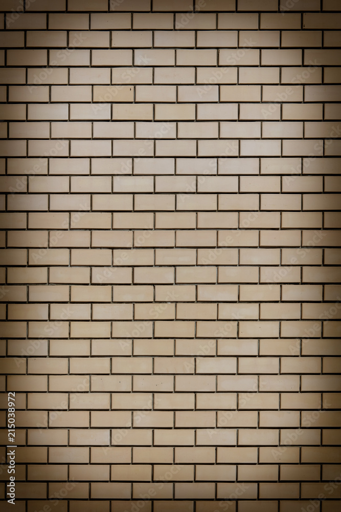 Fototapeta premium Yellow bricks in the wall as an abstract background