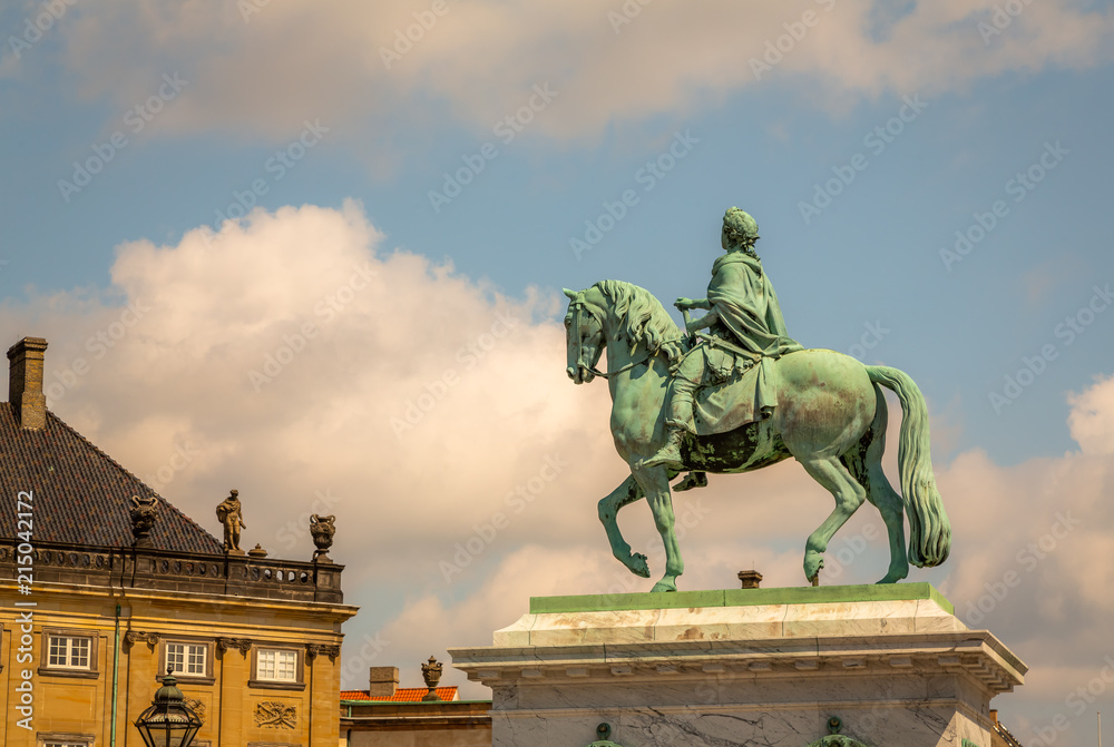 Amalienborg Palace in Copenhagen, Denmark. Surrounding the palace square with its statue of King Frederik V from 1771, Amalienborg is made up of four identical buildings.