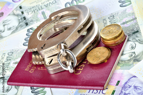 Czech republic passport and police handcuffs on banknotes - international arrest warrant concept photo