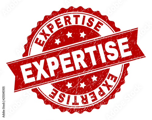 EXPERTISE seal print with corroded texture. Rubber seal imitation has circle medallion form and contains ribbon. Red vector rubber print of EXPERTISE label with corroded texture.