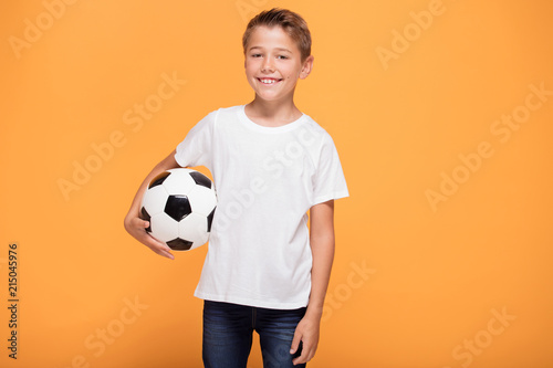 Happy little boy with soccer ball. © neonshot